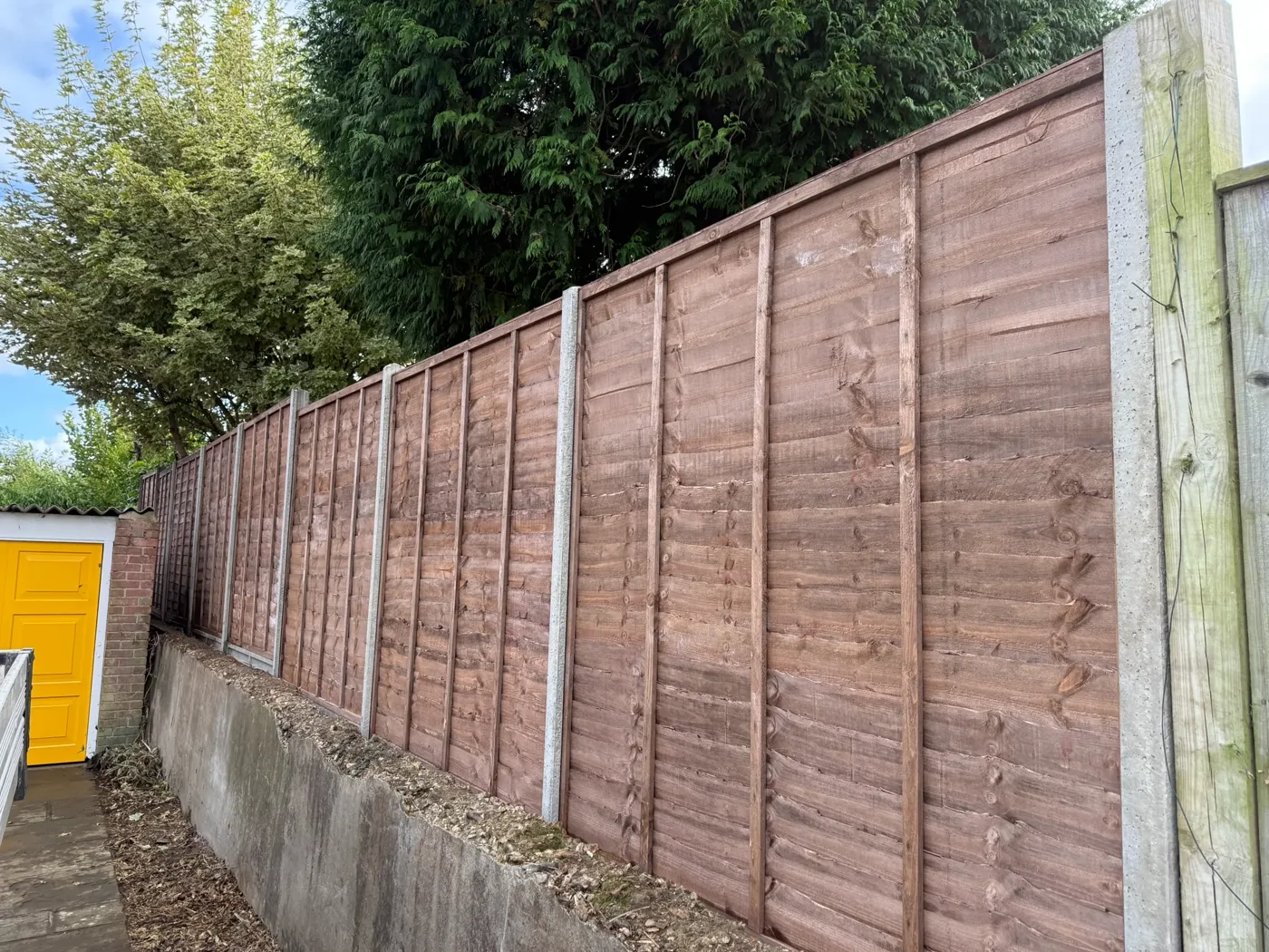 Garden boundary fencing installed behind a Surrey home