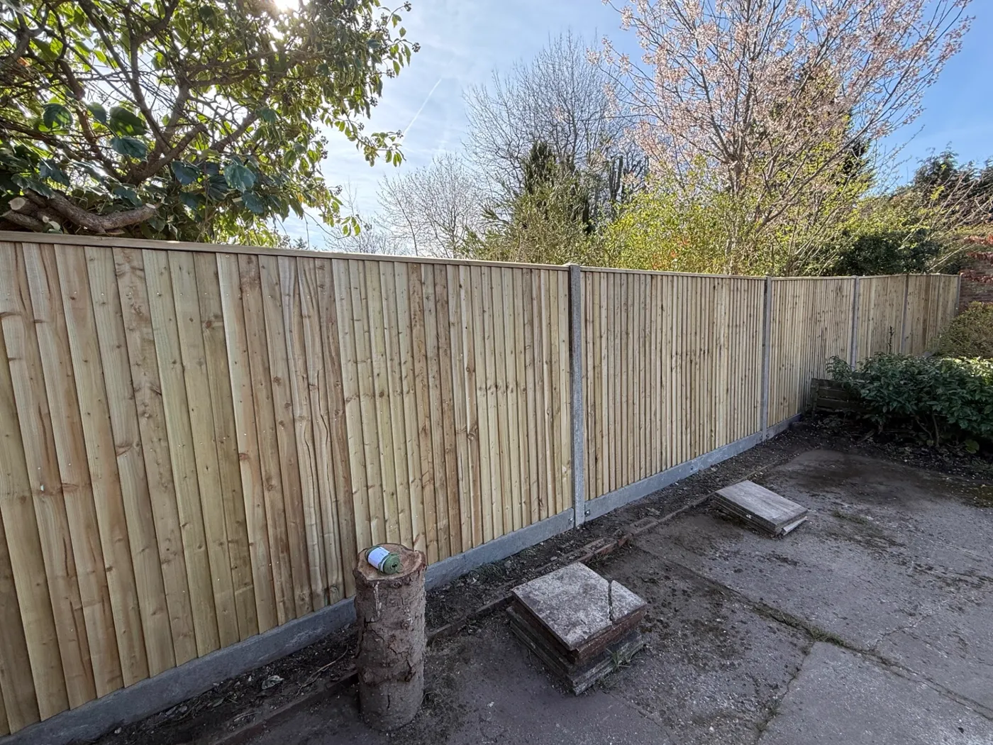 Feather edge closeboard fence with concrete posts along a residential boundary